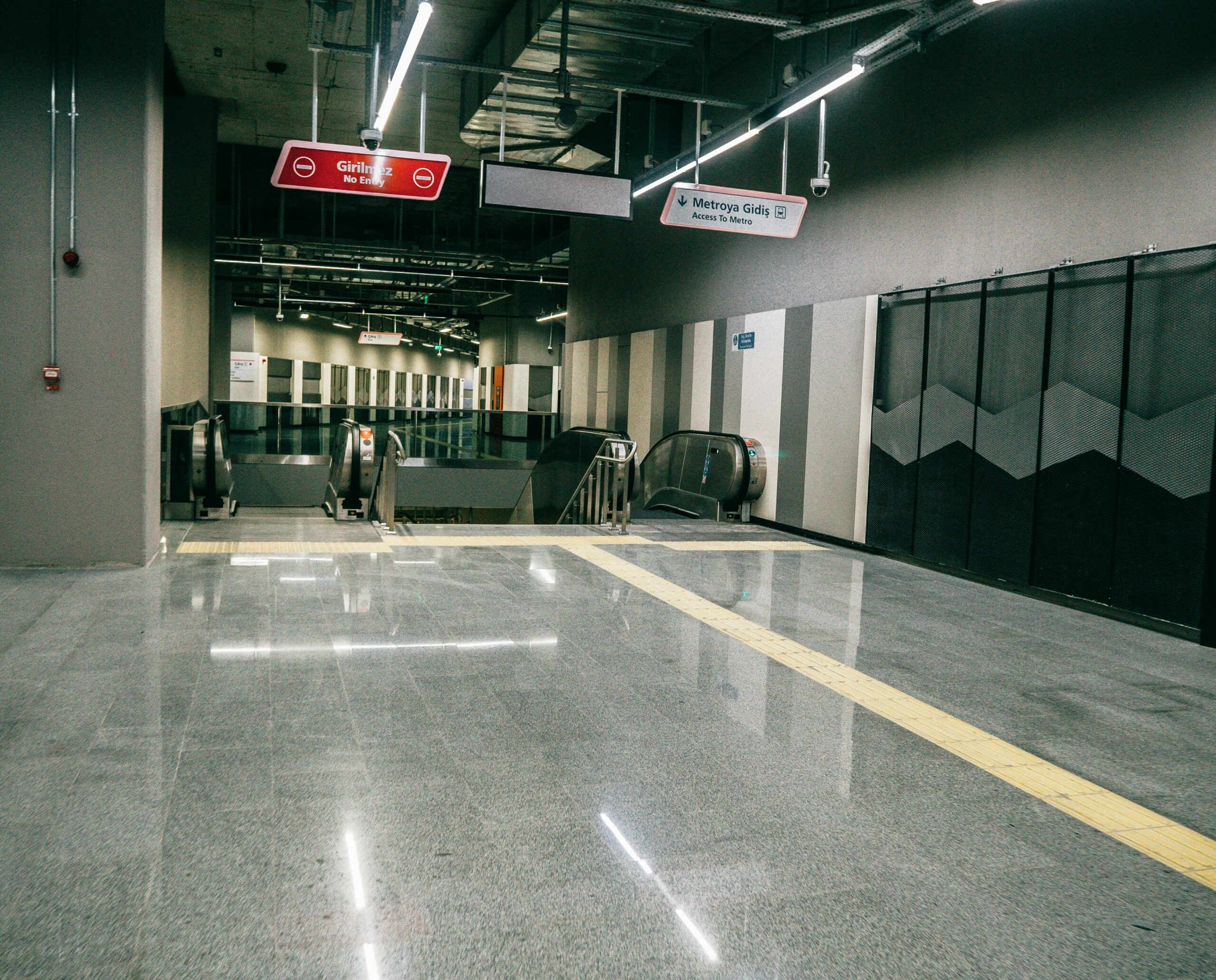 Explore the sleek design of an Istanbul metro station, featuring modern architecture and escalators.